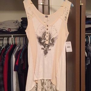 A brand new sleeveless ivory top w/a lace back.